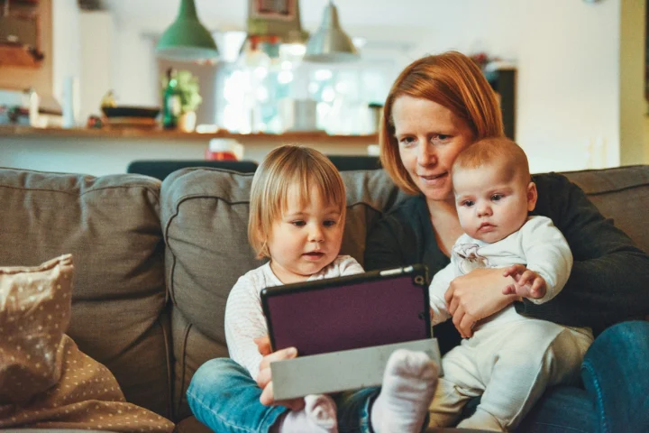 Mother and children relaxing together at home